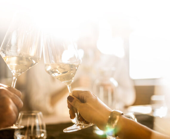 Guests toasting drinks at La Cantera Resort during a celebratory event, with a lively atmosphere and elegant surroundings.